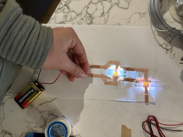 The parallel circuit works and the lights are brighter because I used a 9V battery instead.